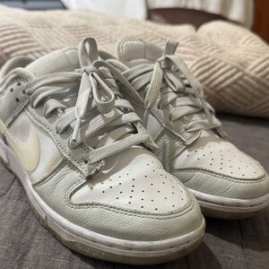Nike Low-Top Sneakers in Light Gray with Pale Yellow Swoosh